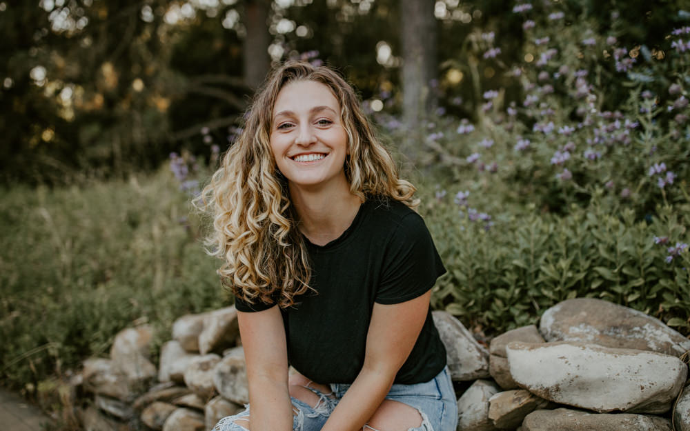 UC Davis Arboretum Portrait Session Sacramento portrait session garden shoot curly hair photos portrait shoot outfit inspo lifestyle photoshoot Sacramento headshot casual sitting posecurly hair headshot Rachel Christopherson photography 