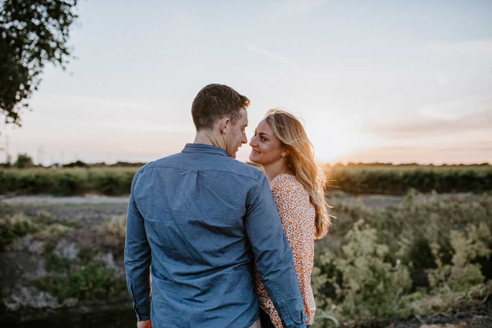 Sacramento River Engagement Session Northern California Weiner dog engagement shoot outfit inspo engagement photos with dog couples shoot posing golden hour sacramento river rachel christopherson photography grape vineyards