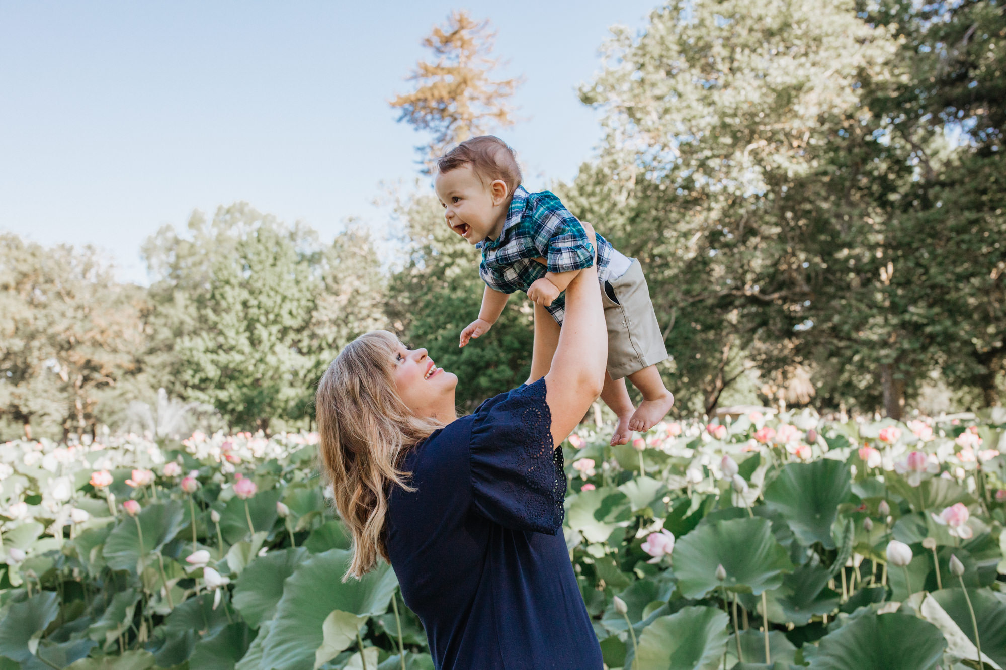 Sacramento Family Photoshoot NorCal Family photos Land park pond family photos Family photoshoot outfit inspiration family photoshoot posing inspo outside family photos mother holding son photos infant photography Sac baby photos Sacramento California baby photo session Rachel Christopherson Photography