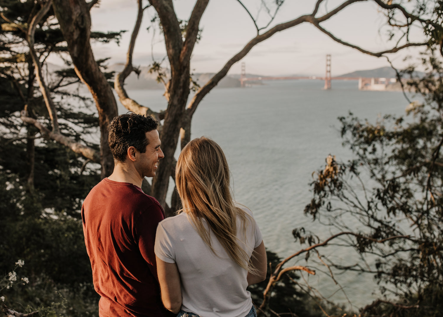 San Francisco Golden Gate Bridge Engagement Session iconic golden gate bridge photo couples posing inspo engagement session outfit Inspo free spirit engagement photos wild and free engagement session bay area bride Rachel christopherson Photography grainy and dramatic photos