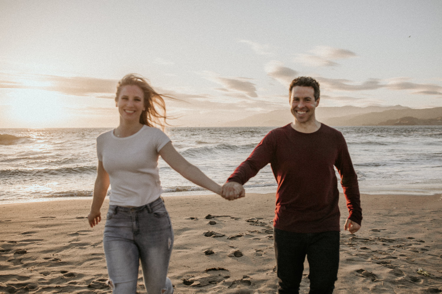 San Francisco engagement session Lands End engagement photos Sutro Baths golden hour photos sunset ocean photos couples posing inspo engagement session outfit Inspo free spirit engagement photos wild and free engagement session bay area bride Rachel christopherson Photography grainy edits