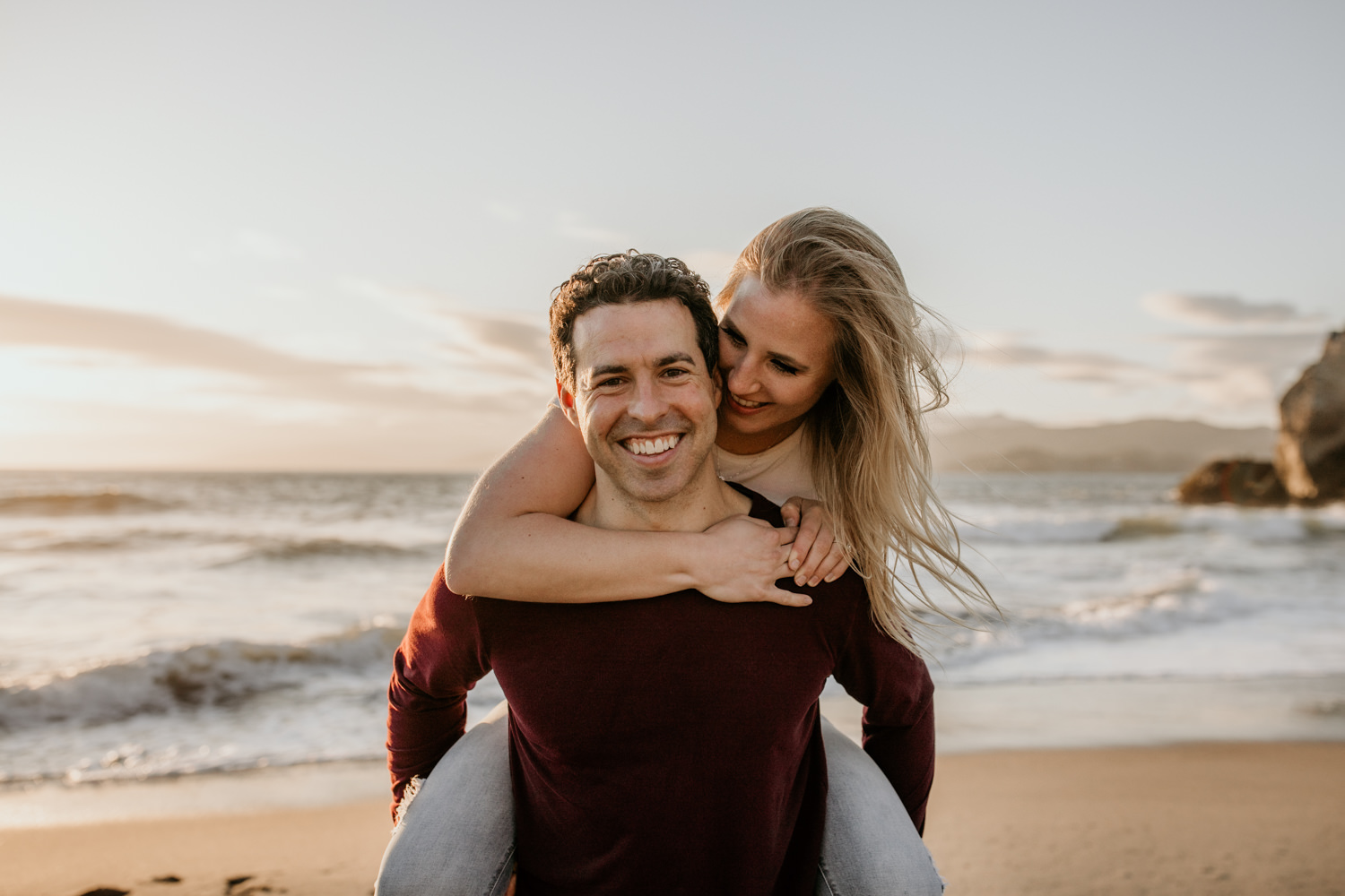 San Francisco engagement session Lands End engagement photos Sutro Baths golden hour photos sunset ocean photos piggy back couples posing inspo engagement session outfit Inspo free spirit engagement photos wild and free engagement session bay area bride Rachel christopherson Photography