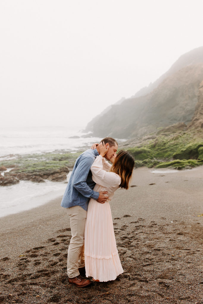 Couple kissing on SF beach, Marin Headlands Engagement Photos, Bay Area Engagement Photos, Bay Area Engagement Photo Locations, Engagement Photo Outfits, Bay Area Beach Engagement Photos, Dog Friendly Bay Area Beaches, Best Locations for Bay Area Engagement Photos, San Francisco Engagement Photos, What to Wear for Engagement Photos, Engagement Photos with dogs, Rachel Christopherson Photography LLC