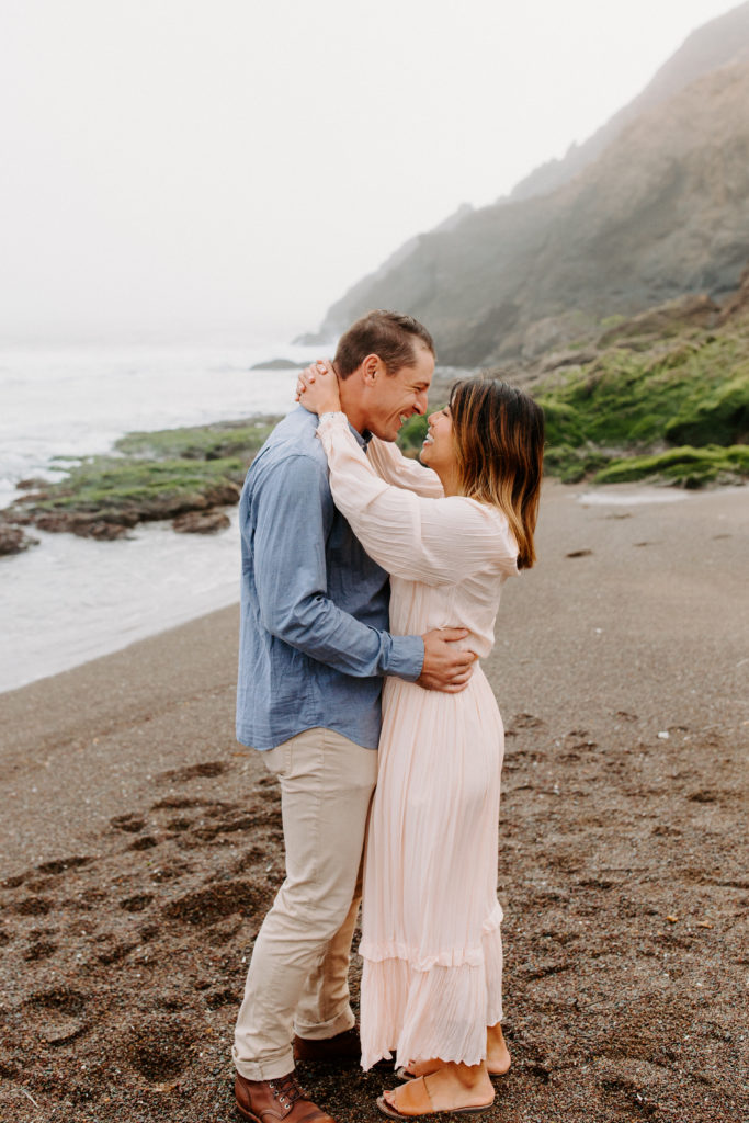 Couple on Beach Smiling, Marin Headlands Engagement Photos, Bay Area Engagement Photos, Bay Area Engagement Photo Locations, Engagement Photo Outfits, Bay Area Beach Engagement Photos, Dog Friendly Bay Area Beaches, Best Locations for Bay Area Engagement Photos, San Francisco Engagement Photos, What to Wear for Engagement Photos, Engagement Photos with dogs, Rachel Christopherson Photography LLC