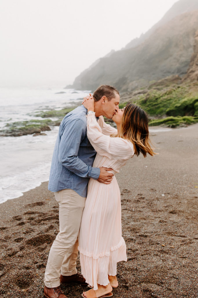 Couple kissing on beach, Marin Headlands Engagement Photos, Bay Area Engagement Photos, Bay Area Engagement Photo Locations, Engagement Photo Outfits, Bay Area Beach Engagement Photos, Dog Friendly Bay Area Beaches, Best Locations for Bay Area Engagement Photos, San Francisco Engagement Photos, What to Wear for Engagement Photos, Engagement Photos with dogs, Rachel Christopherson Photography LLC
