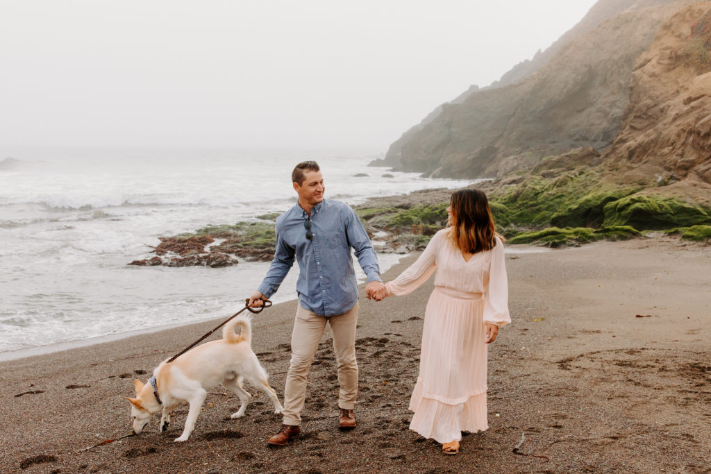 Couple on beach walking dog, Marin Headlands Engagement Photos, Bay Area Engagement Photos, Bay Area Engagement Photo Locations, Engagement Photo Outfits, Bay Area Beach Engagement Photos, Dog Friendly Bay Area Beaches, Best Locations for Bay Area Engagement Photos, San Francisco Engagement Photos, What to Wear for Engagement Photos, Engagement Photos with dogs, Rachel Christopherson Photography LLC