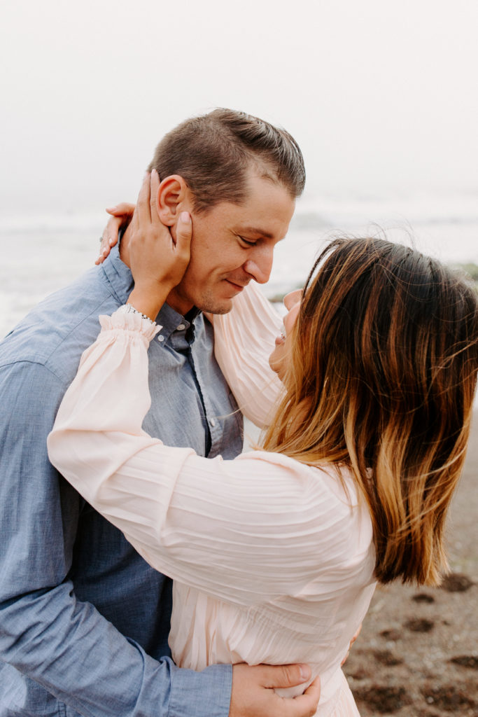Couple looking at each other on beach, Marin Headlands Engagement Photos, Bay Area Engagement Photos, Bay Area Engagement Photo Locations, Engagement Photo Outfits, Bay Area Beach Engagement Photos, Dog Friendly Bay Area Beaches, Best Locations for Bay Area Engagement Photos, San Francisco Engagement Photos, What to Wear for Engagement Photos, Engagement Photos with dogs, Rachel Christopherson Photography LLC 