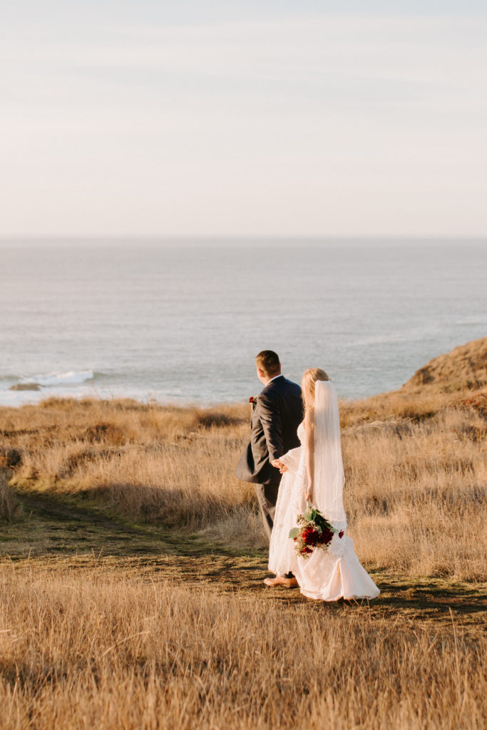bride and groom walking towards field, Mendocino elopement, mendocino wedding, christmas elopement, best places to elope in california, norcal elopement, northern california elopement, elopement inspo, california coast elopement, mendocino california elopement, Rachel Christopherson Photography 