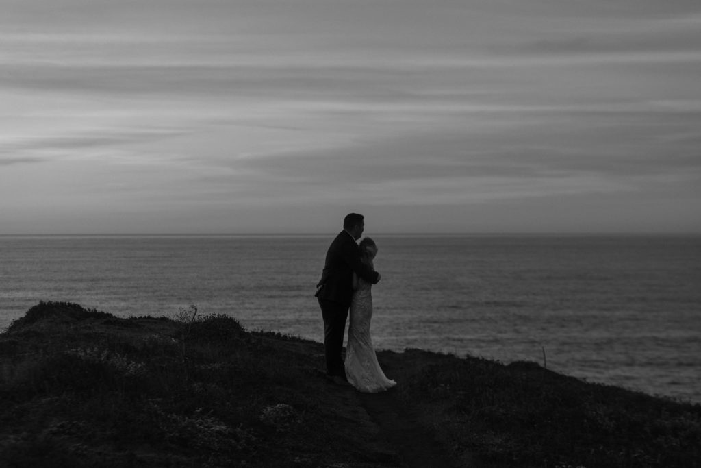 black and white bride and groom looking at ocean, Mendocino elopement, mendocino wedding, christmas elopement, best places to elope in california, norcal elopement, northern california elopement, elopement inspo, california coast elopement, mendocino california elopement, Rachel Christopherson Photography 