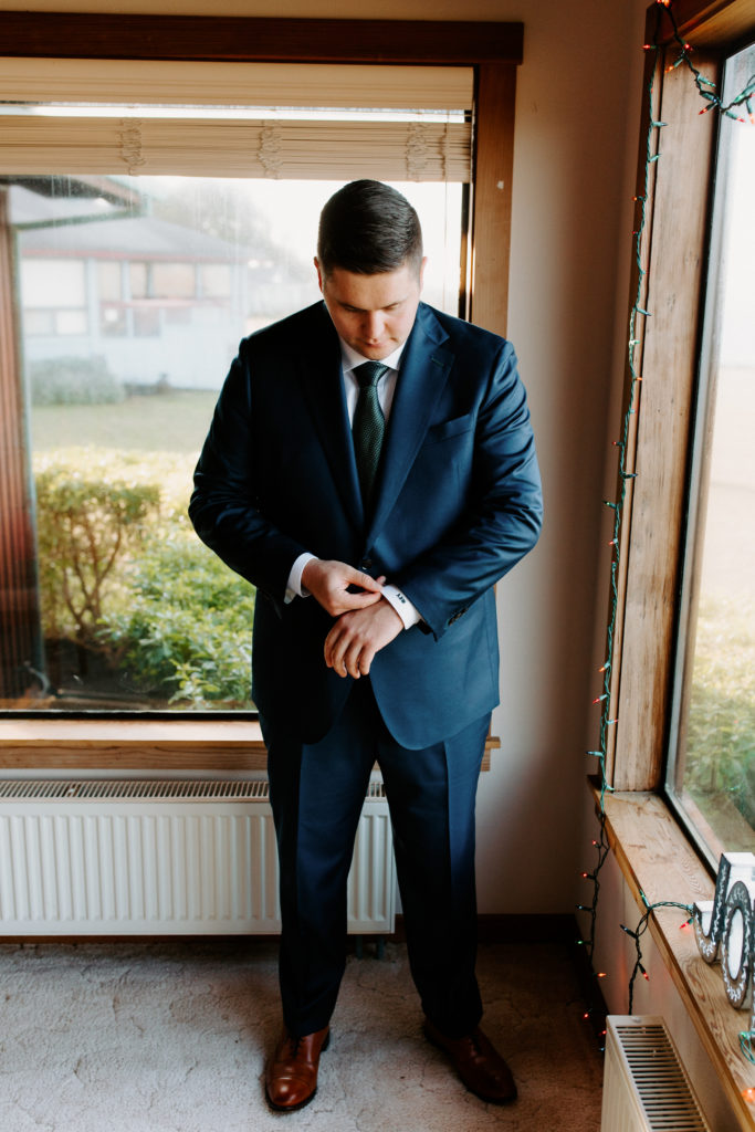 groom getting ready, groom buttoning cuff, christmas elopement, best places to elope in california, norcal elopement, northern california elopement, elopement inspo, california coast elopement, Rachel Christopherson Photography
