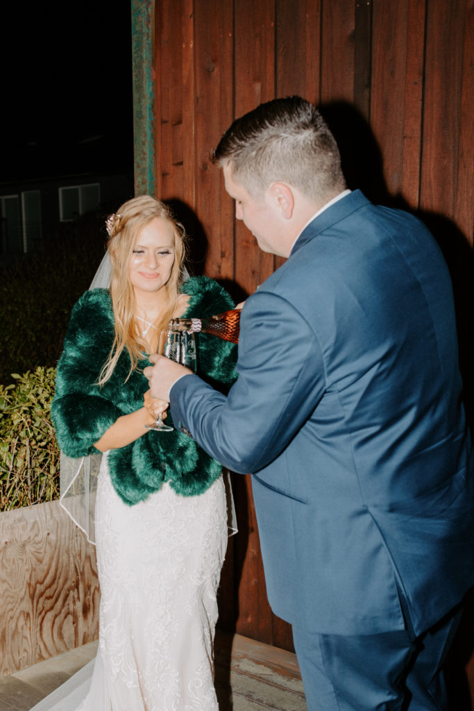 christmas elopement, winter elopement, glamorous bride, bridal coat, winter wedding dress, winter wedding fur shawl, winter wedding fur shawl wraps, champagne toast, best places to elope in california, norcal elopement, northern california elopement, elopement inspo, california coast elopement, Rachel Christopherson Photography