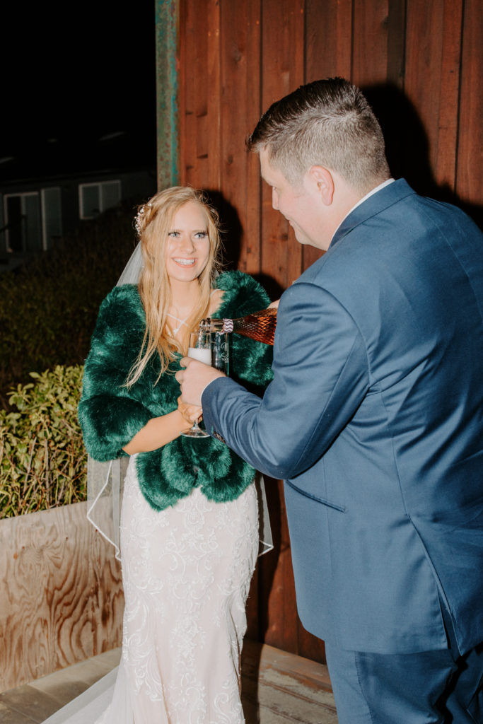 christmas elopement, winter elopement, glamorous bride, bridal coat, winter wedding dress, winter wedding fur shawl, winter wedding fur shawl wraps, champagne toast, best places to elope in california, norcal elopement, northern california elopement, elopement inspo, california coast elopement, Rachel Christopherson Photography