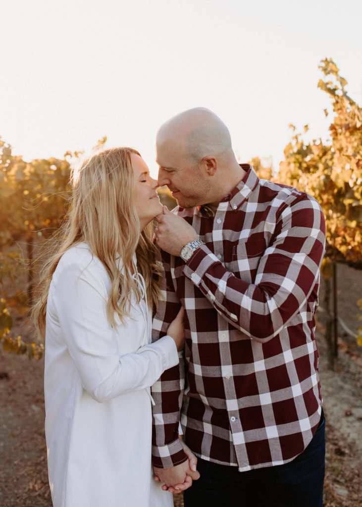 couple in golden vineyard, vineyard engagement photos, Sacramento engagement photos, sacramento engagement, sacramento engagement photographer sacramento engagement photo locations, sacramento wedding photographer, rachel christopherson photography, engagement photo outfit inspo