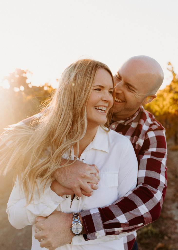 couple in golden vineyard, vineyard engagement photos, Sacramento engagement photos, sacramento engagement, sacramento engagement photographer sacramento engagement photo locations, sacramento wedding photographer, rachel christopherson photography, engagement photo outfit inspo