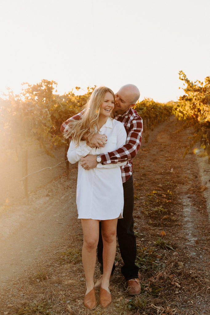 couple in golden vineyard, vineyard engagement photos, Sacramento engagement photos, sacramento engagement, sacramento engagement photographer sacramento engagement photo locations, sacramento wedding photographer, rachel christopherson photography, engagement photo outfit inspo