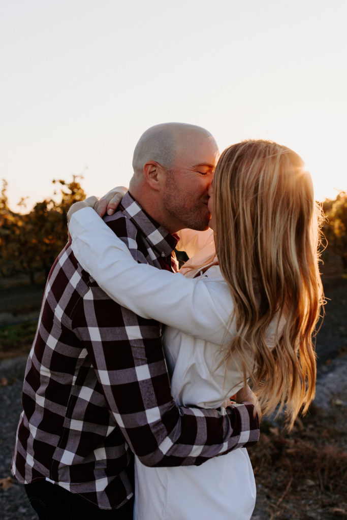 couple in golden vineyard during sunset, vineyard engagement photos, Sacramento engagement photos, sacramento engagement, sacramento engagement photographer sacramento engagement photo locations, sacramento wedding photographer, rachel christopherson photography, engagement photo outfit inspo