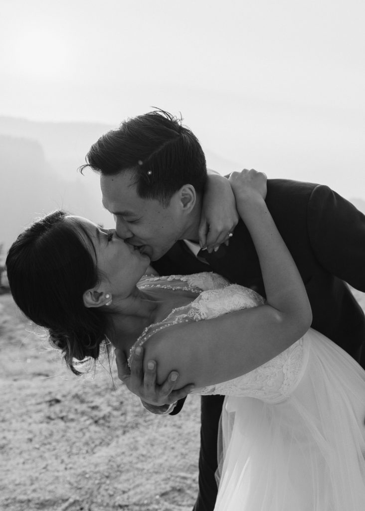 black and white photo of groom dipping bride, Taft Point elopement, Yosemite Elopement, Glacier Point Elopement, best places to elope in california, northern california elopement, Rachel Christopherson Photography