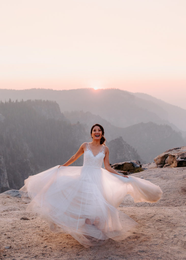 bride twirling sunset photos, Taft Point elopement, bridal portrait, adventurous bride, Yosemite Elopement, Glacier Point Elopement, best places to elope in california, northern california elopement, Rachel Christopherson Photography