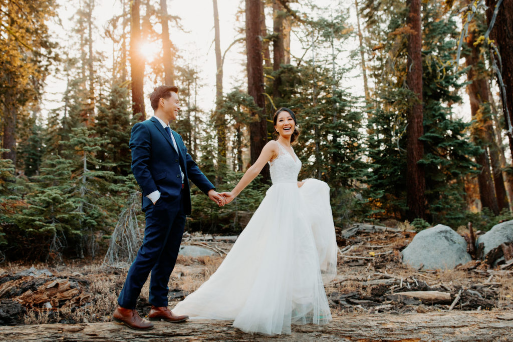 bride and groom walk across log in forest, Taft Point elopement, Yosemite Elopement, Glacier Point Elopement, best places to elope in california, northern california elopement, Rachel Christopherson Photography
