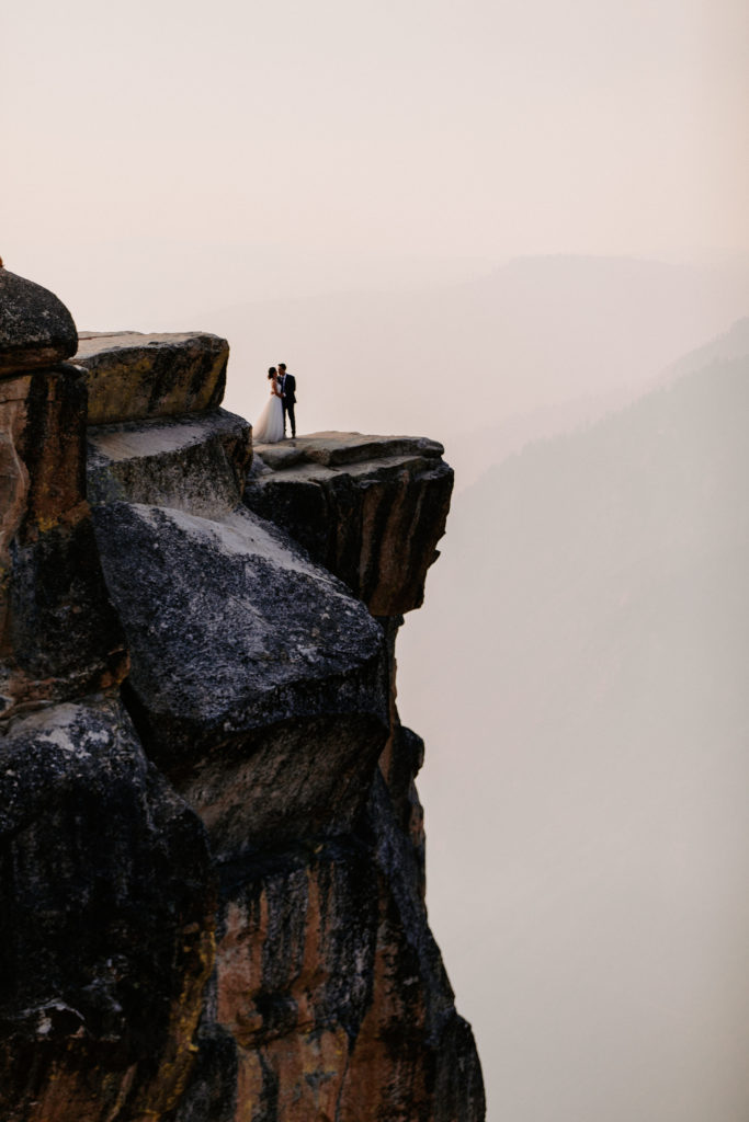 Wide shot of Bride and groom at Taft Point,, Taft Point elopement, Yosemite Elopement, Glacier Point Elopement, best places to elope in california, northern california elopement, Rachel Christopherson Photography
