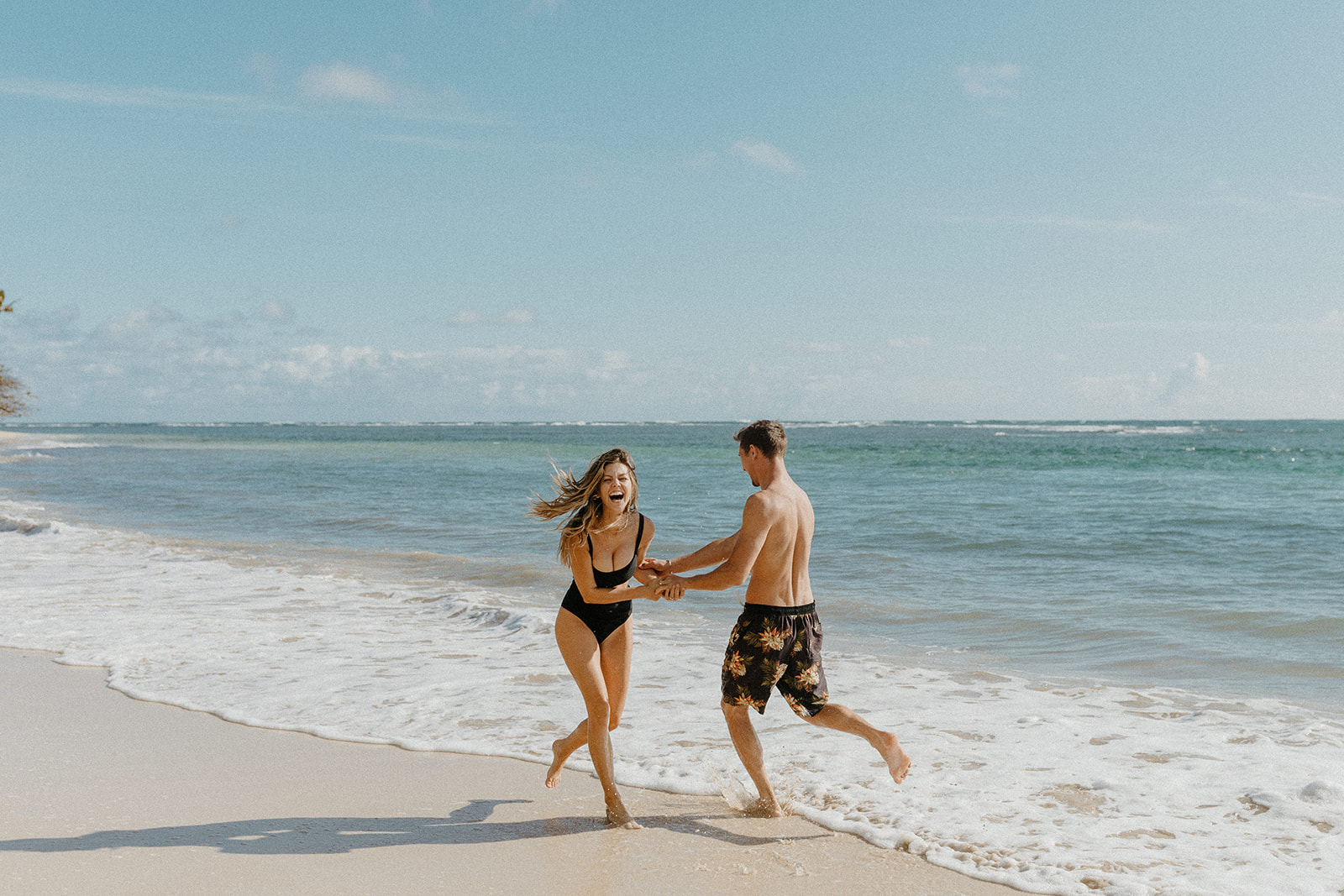 San Luis Obispo wedding photographer, Oahu engagement photos, best places to take photos in Oahu, best Oahu hikes, Hawaii wedding photographer, Hawaii engagement photos, best Hawaii hikes, Maui wedding photographer, Maui engagement photos, Kauai wedding photographer, Kauai engagement photos, what to wear for your engagement photos, engagement outfits, casual engagement photos outfits, neutral engagement photo outfits, tropical engagement photos, engagement photo ideas, what to wear for engagement pictures, beach engagement photos, Hawaii beaches, Rachel Christopherson Photography