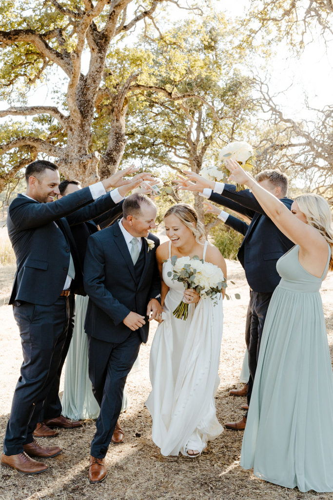 Sacramento wedding, sacramento wedding photographer, river highlands ranch, river highlands ranch wedding, barn wedding sacramento, rustic wedding venue sacramento, best places to get married in sacramento, vineyard wedding sacramento, sacramento winery wedding, northern california barn wedding venues, rachel christopherson photography, blue bridesmaids dresses, wedding party tunnel, wedding party photos