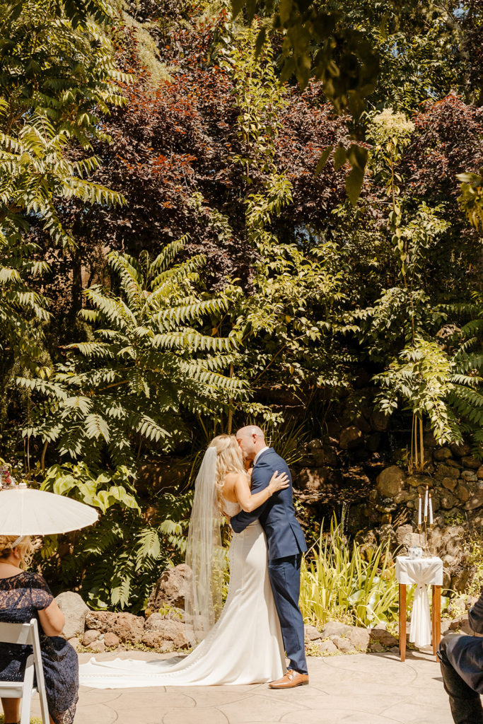 Rachel Christopherson Photography-Sacramento Garden Wedding-Rustic Wedding-Summer Wedding-Northern California-Nor Cal-Wedding Ceremony-Exchanging Vows-Wedding Dress With Train-Bridal Veil-Navy Groom's Suit