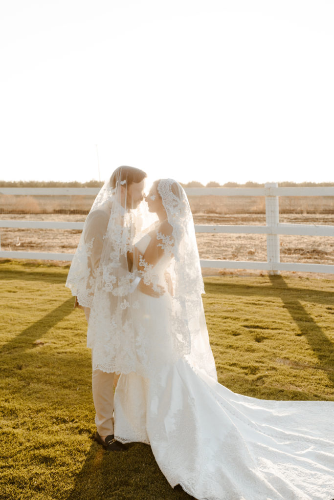 rachelchristophersonphotography-northern califorrnia wedding-traditional wedding-nor cal wedding-traditional ceremony-northern california wedding photographer-sacramento wedding-sacramento wedding photographer-ranch wedding-golden hour-lacey wedding dress-beige grooms suit-long train veil-bridal veil