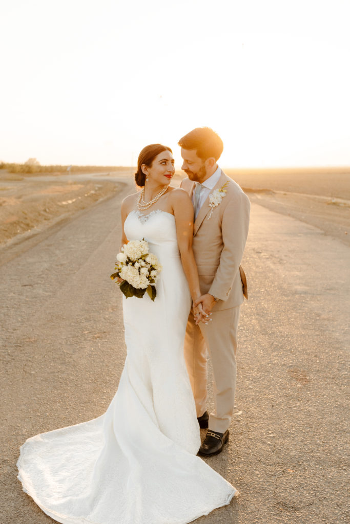 rachelchristophersonphotography-northern califorrnia wedding-traditional wedding-nor cal wedding-traditional ceremony-northern california wedding photographer-sacramento wedding-sacramento wedding photographer-ranch wedding-golden hour-lacey wedding dress-beige grooms suit-long train veil-bridal veil