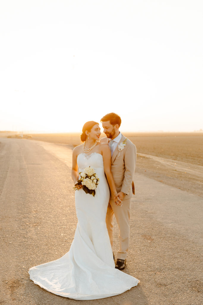 rachelchristophersonphotography-northern califorrnia wedding-traditional wedding-nor cal wedding-traditional ceremony-northern california wedding photographer-sacramento wedding-sacramento wedding photographer-ranch wedding-golden hour-lacey wedding dress-beige grooms suit-long train veil-bridal veil