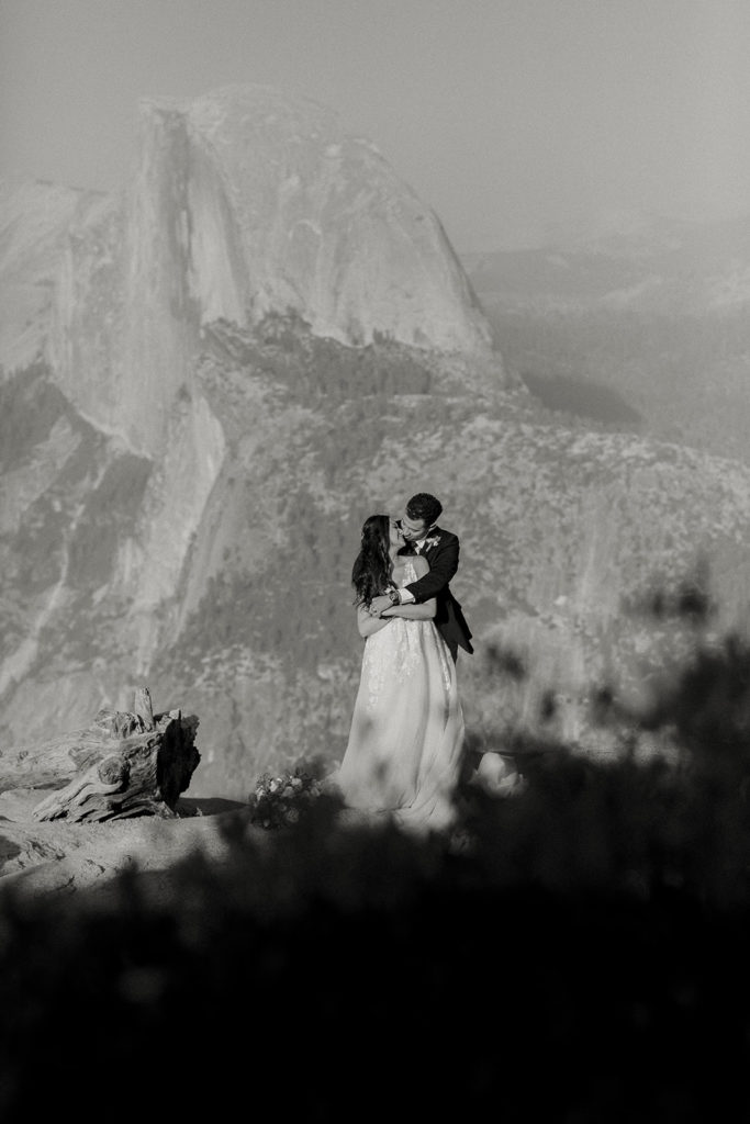 rachelchristophersonphotos-glacier point yosemite elopement-yosemite elopement-glacier point elopement-mountain top elopement-northern california elopement-bride and groom-slick black suit-lacey floral wedding gown-black and white wedding photos