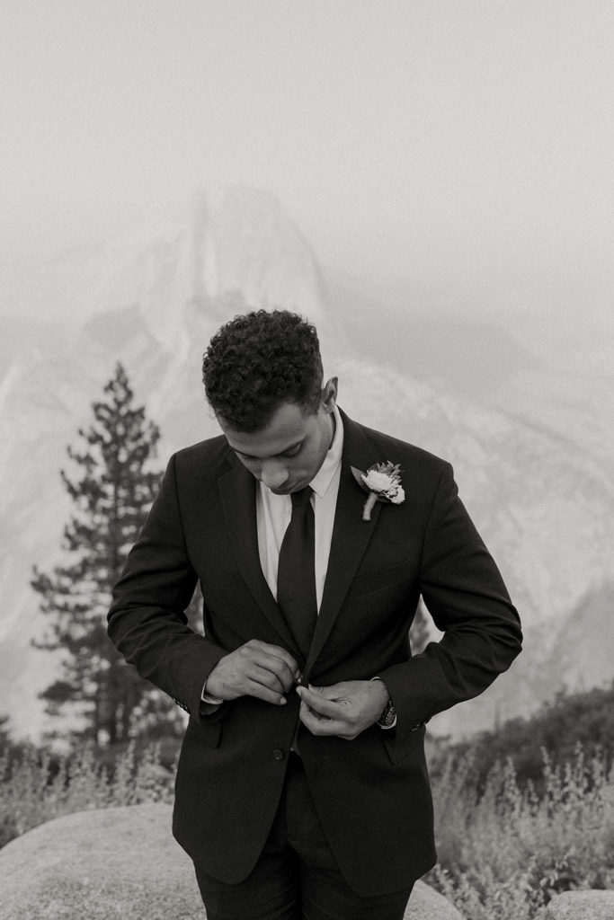 rachelchristophersonphotos-glacier point yosemite elopement-yosemite elopement-glacier point elopement-mountain top elopement-northern california elopement-bride and groom-slick black suit-lacey floral wedding gown-black and white wedding photos