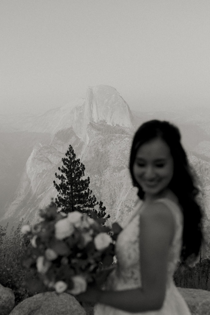 rachelchristophersonphotos-glacier point yosemite elopement-yosemite elopement-glacier point elopement-mountain top elopement-northern california elopement-bride and groom-slick black suit-lacey floral wedding gown-black and white wedding photos
