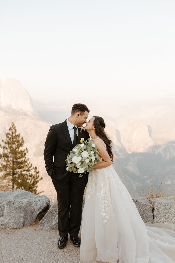 rachelchristophersonphotos-glacier point yosemite elopement-yosemite elopement-glacier point elopement-mountain top elopement-northern california elopement-bride and groom-slick black suit-lacey floral wedding gown