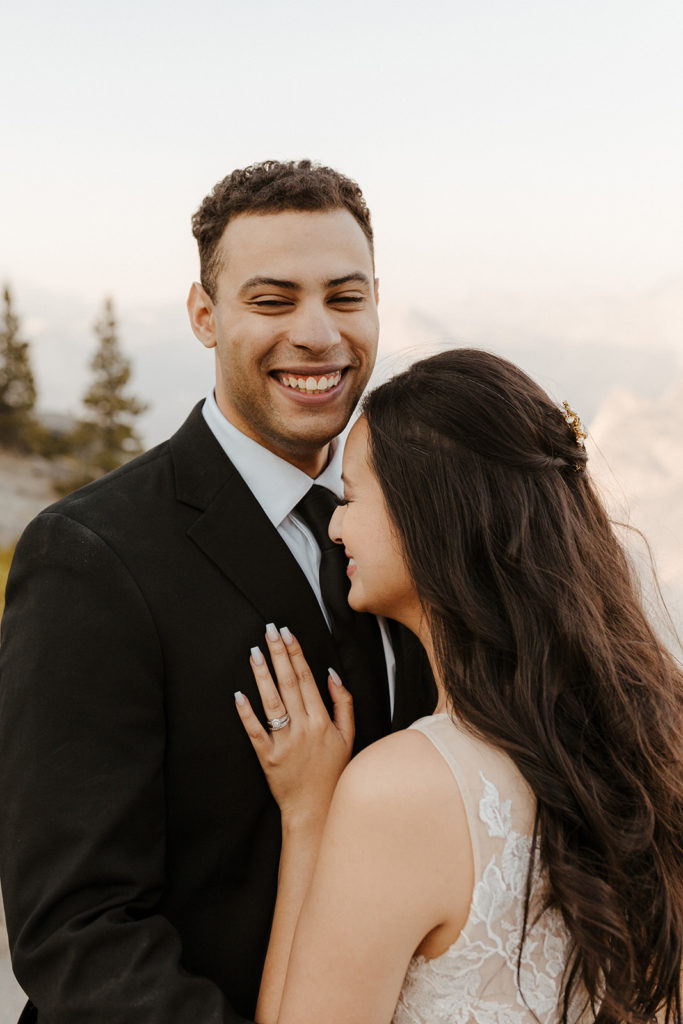 rachelchristophersonphotos-glacier point yosemite elopement-yosemite elopement-glacier point elopement-mountain top elopement-northern california elopement-bride and groom-slick black suit-lacey floral wedding gown