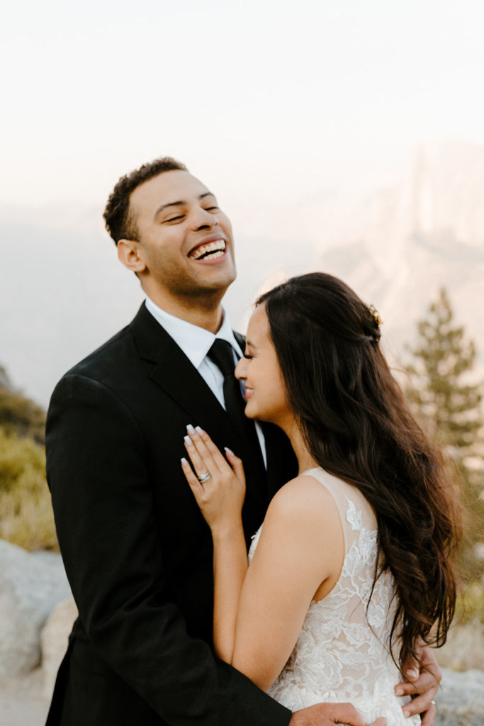 rachelchristophersonphotos-glacier point yosemite elopement-yosemite elopement-glacier point elopement-mountain top elopement-northern california elopement-bride and groom-slick black suit-lacey floral wedding gown