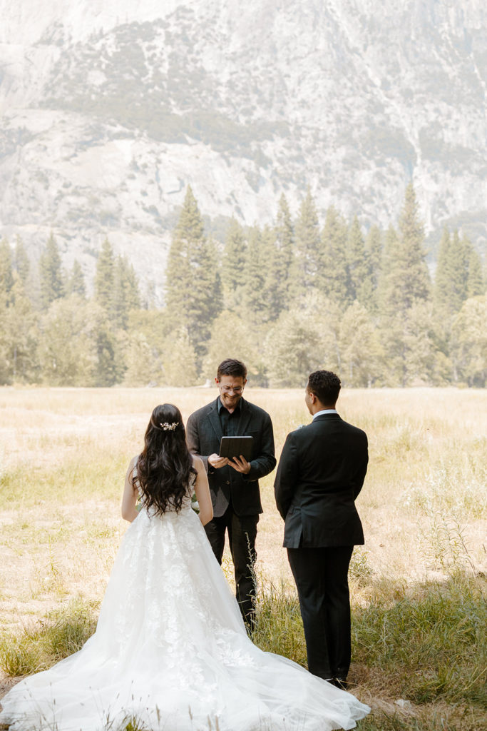 rachelchristophersonphotos-swinging bridge-yosemite elopement-yosemite elopement-swinging bridge elopement-mountain top elopement-northern california elopement-bride and groom-slick black suit-lacey floral wedding gown