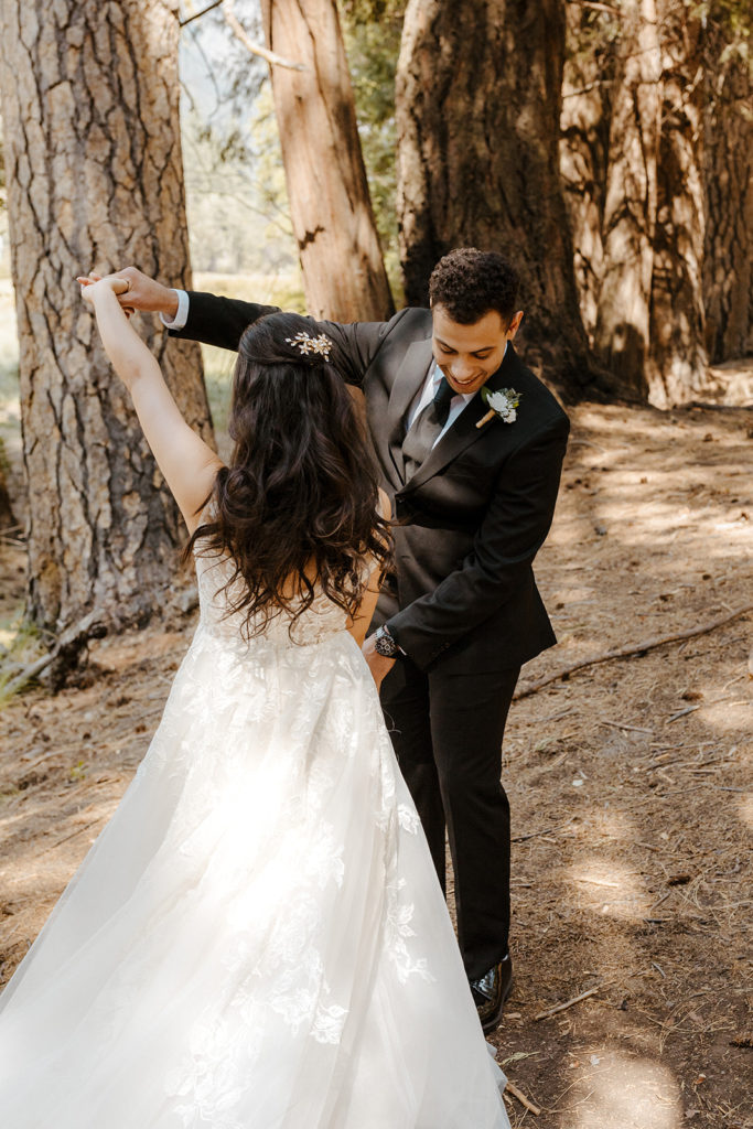 rachelchristophersonphotos-swinging bridge-yosemite elopement-yosemite elopement-swinging bridge elopement-mountain top elopement-northern california elopement-bride and groom-slick black suit-lacey floral wedding gown-bride and groom first look-first look photos