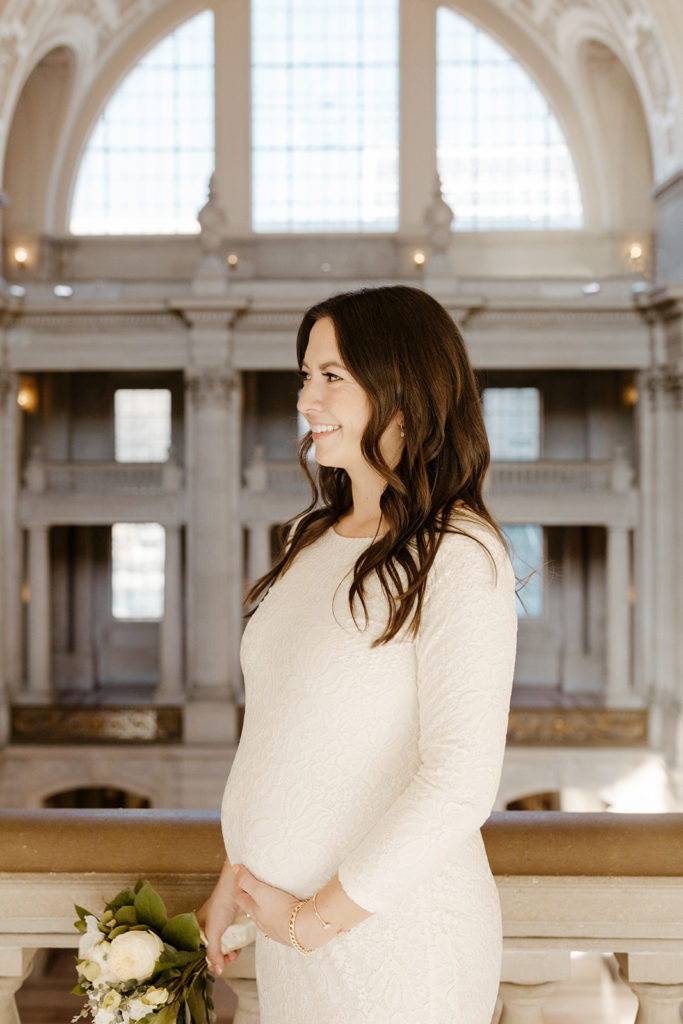 Rachel Christopherson Photographer-SF, San Francisco city hall elopement, san francisco wedding, bride and groom walking down stairs, candid wedding portraits, bridal wedding portrait, ivory wedding dress