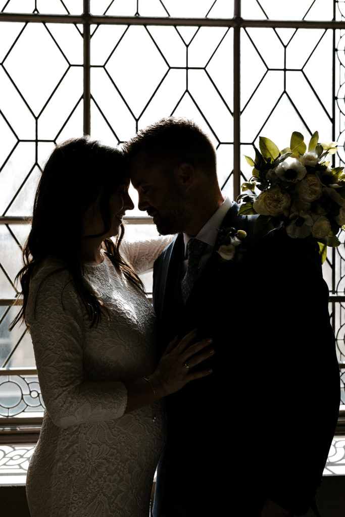 Rachel Christopherson Photography-SF, San Francisco city hall elopement, San Francisco wedding, bride and groom in front of window portrait