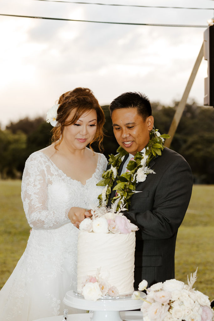 Rachel Christopherson Photography - North Shore Oahu wedding at Sunset Ranch, wedding reception photos, bride and groom cutting cake