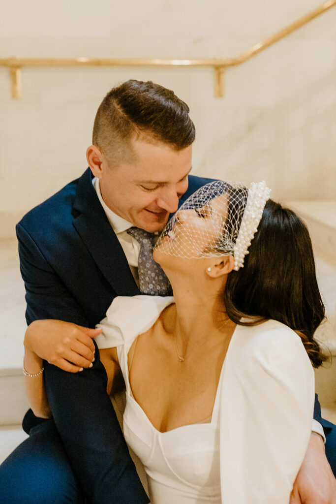Rachel C Photography - bride and groom smiling at each other on san francisco city hall stairs