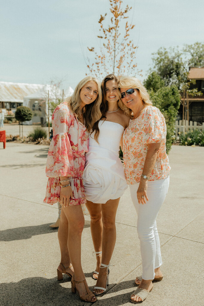 Bride posing with family and friends