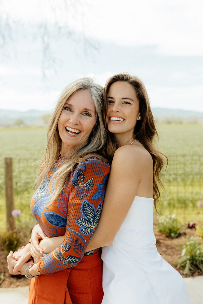 Bride posing with her mother