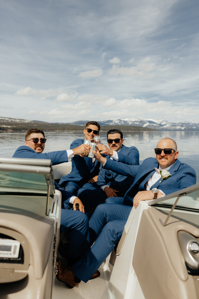 Groom and groomsmen on sailboat on Lake Tahoe