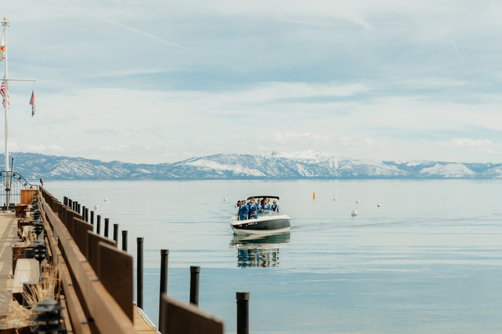 Groom and groomsmen on sailboat on Lake Tahoe