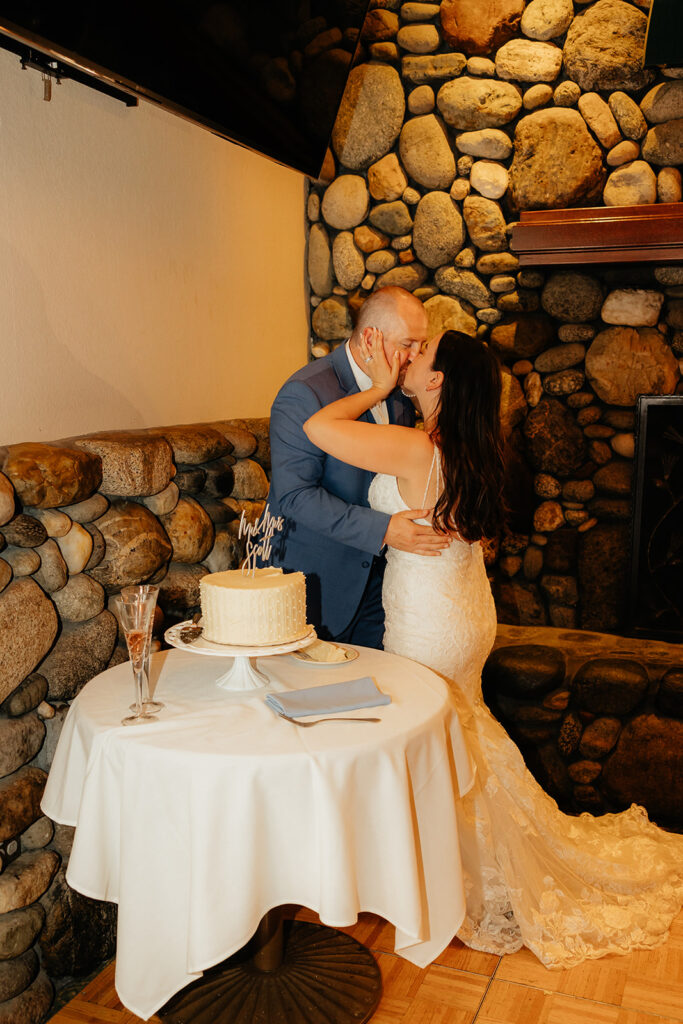 Bride and groom cutting wedding cake
