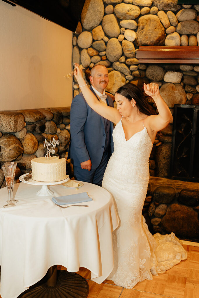 Bride and groom cutting wedding cake