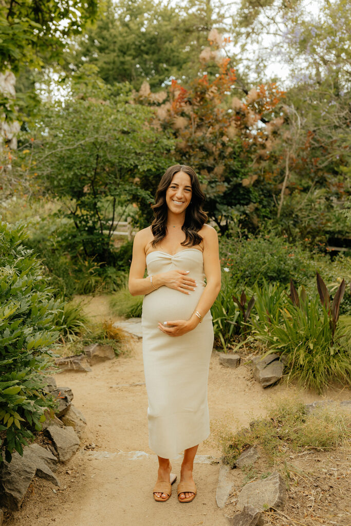 Pregnant mother holding her belly for photoshoot