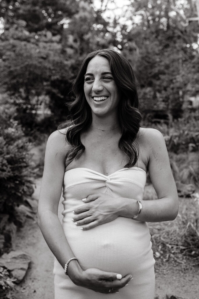 Pregnant mother holding her belly for photoshoot